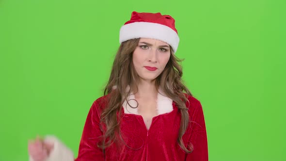 Santa Girl in Suit Shows Thumbs Down, Green Screen