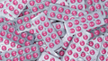 Full frame heap of round pink tablets pills in blister pack. Prescription drugs. Painkiller medicine - PhotoDune Item for Sale
