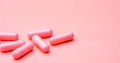Pink capsules pill on pink background. Vitamins and supplements. Online pharmacy. Pharmacy store - PhotoDune Item for Sale