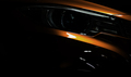 Closeup headlight of shiny orange luxury SUV compact car. Elegant electric car technology - PhotoDune Item for Sale