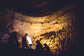 Group of speleologists resting and cooking on gas fire during a cave exploration - PhotoDune Item for Sale