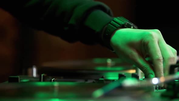 Video clip of hip hop dj playing musical tracks on concert in close up