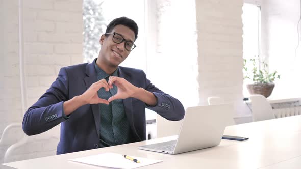 Handmade Heart Gesture By Smiling Young African Man