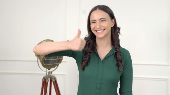 Indian woman showing Thumbs up