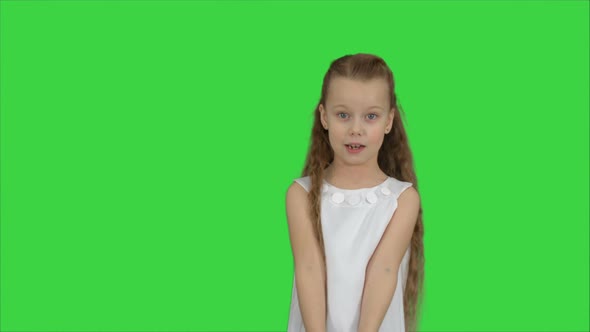 Positive Teen Girl Talking To a Camera with a Smile on a Green Screen, Chroma Key