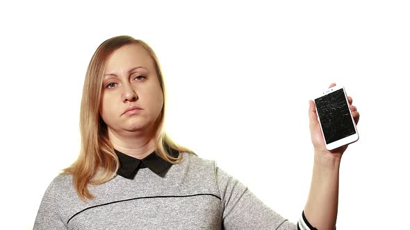 Tired Sleepy Woman Holding a Smartphone with a Broken Screen