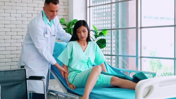 Doctor in Professional Uniform Examining Patient at Hospital