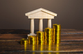 Bank building and increasing stacks of coins.  - PhotoDune Item for Sale