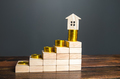 Steps with increasing profits and a house on top. - PhotoDune Item for Sale
