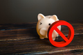 Piggy bank and prohibition sign NO. Bypass restrictions, loopholes in laws.  - PhotoDune Item for Sale