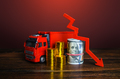 Truck, money and red down arrow. Low profits from transport industry.  - PhotoDune Item for Sale