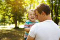 Dad plays with his little son in the park outdoors.  - PhotoDune Item for Sale