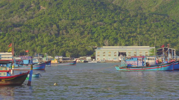 Big Fisherman Boats Coming Out of the Port in Asia. Overfishing Concept