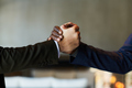 Close-up of hands of two young male business partners in handshake - PhotoDune Item for Sale