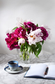 Bouquet of beautiful peonies with cup of coffee - PhotoDune Item for Sale