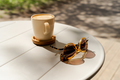 Eyeglasses and cup of coffee on wooden table. Travel, vacation concept. - PhotoDune Item for Sale