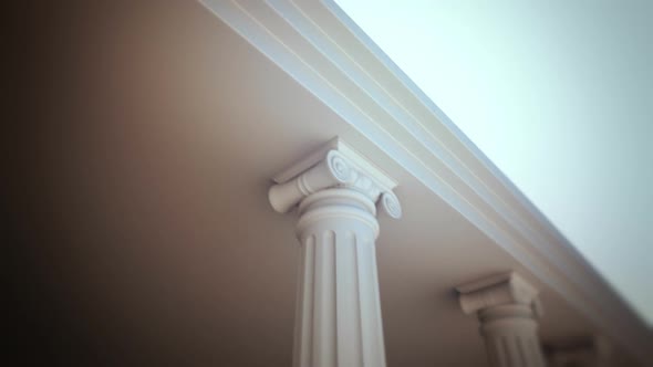 Endless walk with a left-side view of white classical Greek columns. Loopable HD