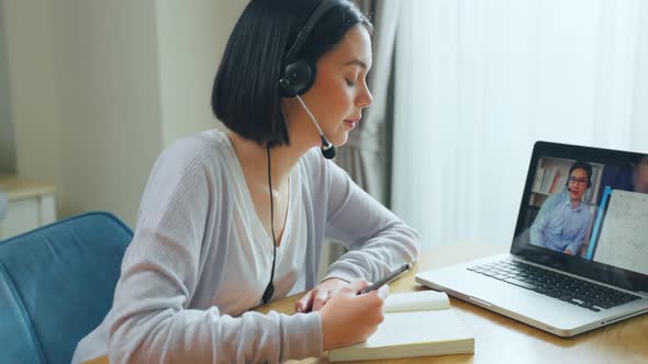 Homeschool Caucasian cute young girl student use laptop learn virtual internet online class at home.