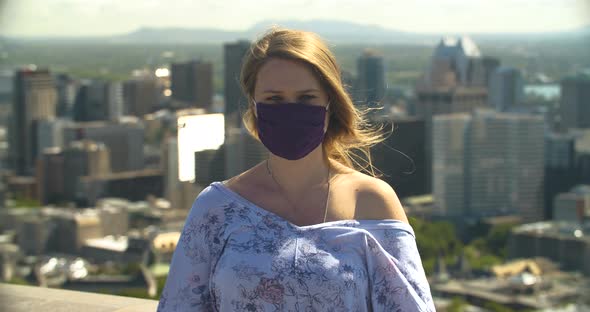 Portrait of Young Healthy Woman Removing Mask