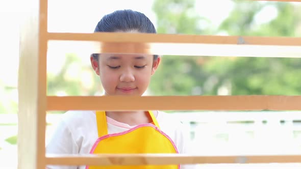 Beautiful Asian Girl Painting Wooden Shelf By Brush Outdoors