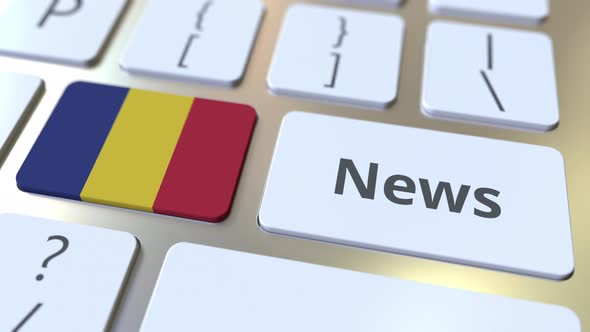 News Text and Flag of Romania on the Keys of Keyboard