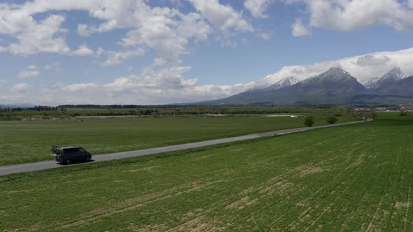 Aerial Shots of a Cmapervan Driving Into the Mountains