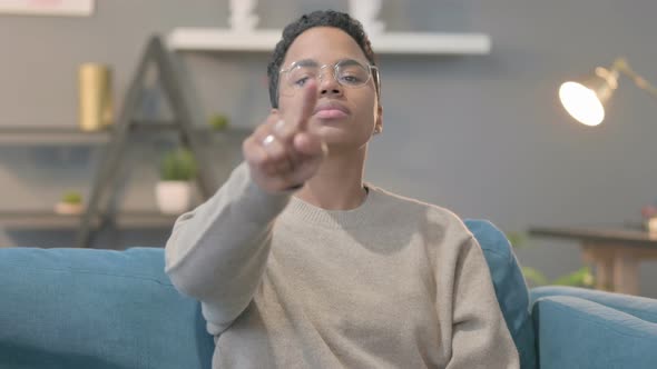 Portrait of African Woman Pointing Towards Camera