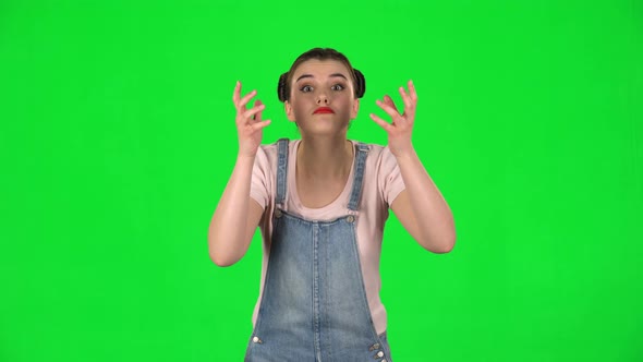 Woman Looking at Camera with Anticipation, Then Very Upset Against Green Screen