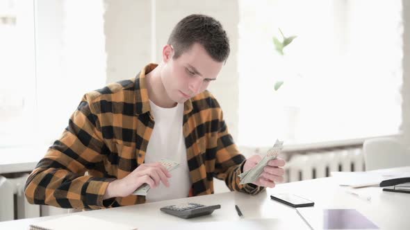 Casual Young Man Calculating Finance Counting Dollar