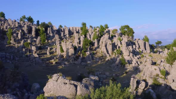 Majestic Landscape with Unusual Rock Formations and Green Trees