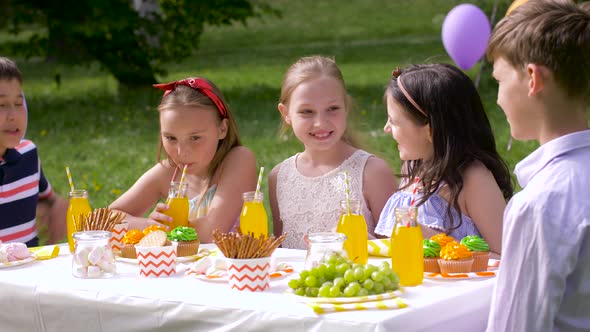 Happy Kids on Birthday Party at Summer Garden