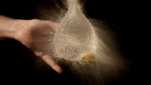 Yellow Water Balloon Popped In Slow Motion