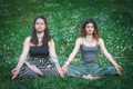 Classic yoga pose by a pair of women - PhotoDune Item for Sale