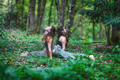 Couple of girls practice yoga in the woods - PhotoDune Item for Sale