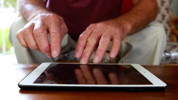 Close up view of hands using tablet pc