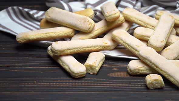 Italian Savoiardi Ladyfingers Biscuits on Wooden Backgound