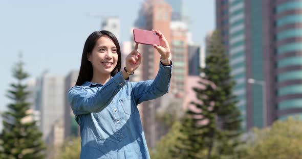 Young woman use of mobile phone in city