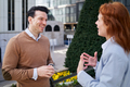A businessman smiling while having a conversation with his partner outdoors - PhotoDune Item for Sale
