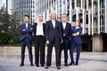Portrait of business people standing outdoors in office area - PhotoDune Item for Sale