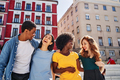 A group of friends having a good time together talking and laughing - PhotoDune Item for Sale