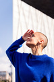 confident woman with shaved head looking to sky - PhotoDune Item for Sale
