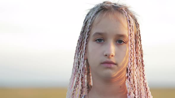 Portrait of a Cute Teenage Girl with African Braids