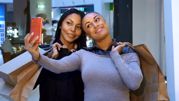 Women Make Selfie with Shopping Bags