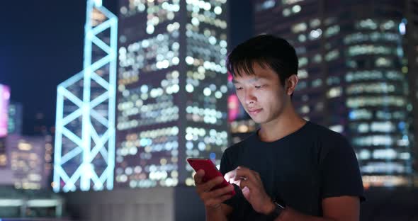 Man use of mobile phone in city of Hong Kong