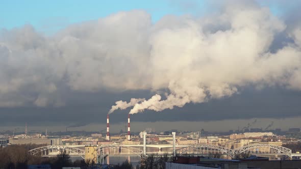 White Smoke From Pipes of a Thermal Power Plant Over City