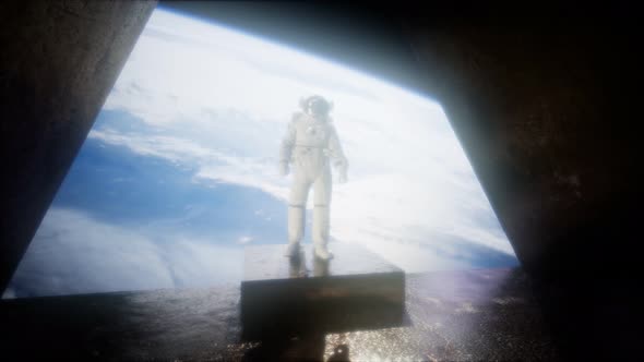 Astronaut on the Space Observatory Station Near Earth