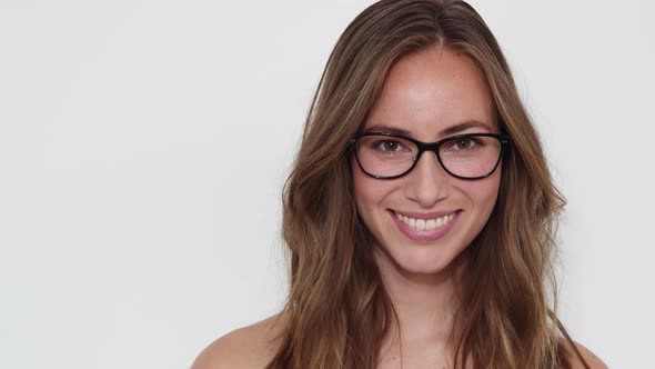 Woman with Brown Eyes Entering the Frame, Smiles and then Walks Out