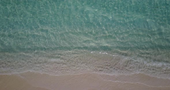 Beautiful overhead abstract view of a summer white paradise sand beach and blue ocean background 