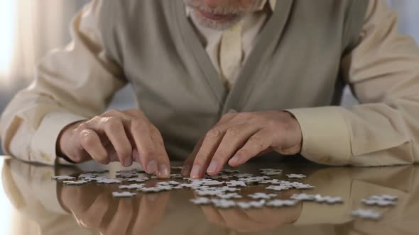 Grandfather Trying to Put Puzzle Together, Concentration Exercise, Motor Skills