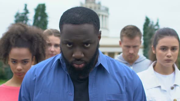 Afro-American Man With Multiethnic Friends on Silent Rally for Racial Equality